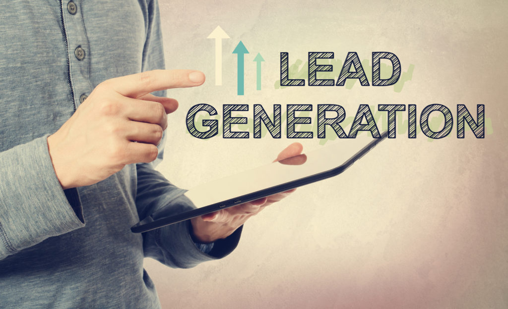 4 Ways to Increase Your Franchise Lead Generation Efforts 1 Young man pointing at Lead Generation text over a tablet computer